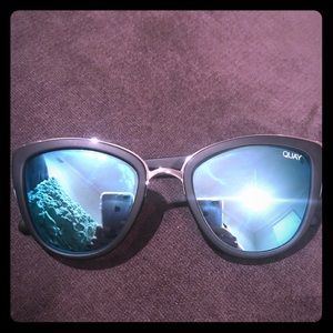 Quay matte black and blue sunglasses.